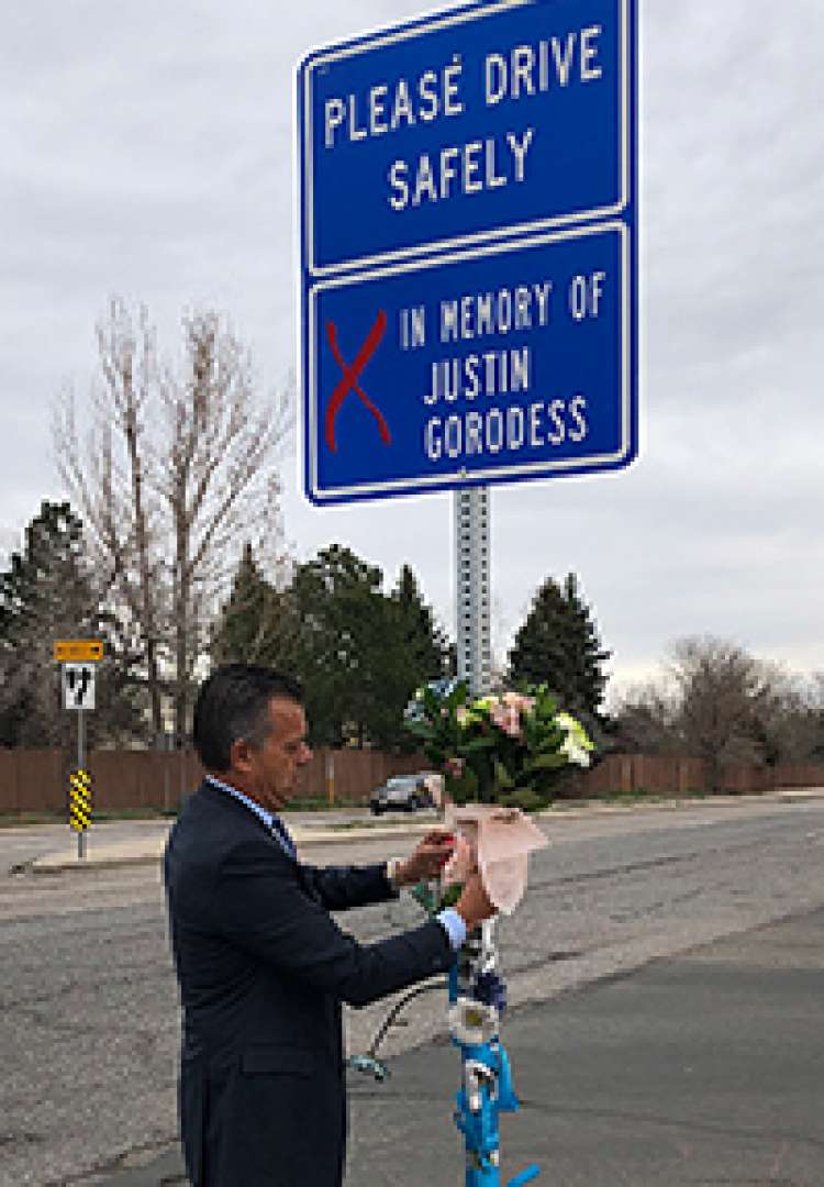 Flowers on Justin Gorodess Sign